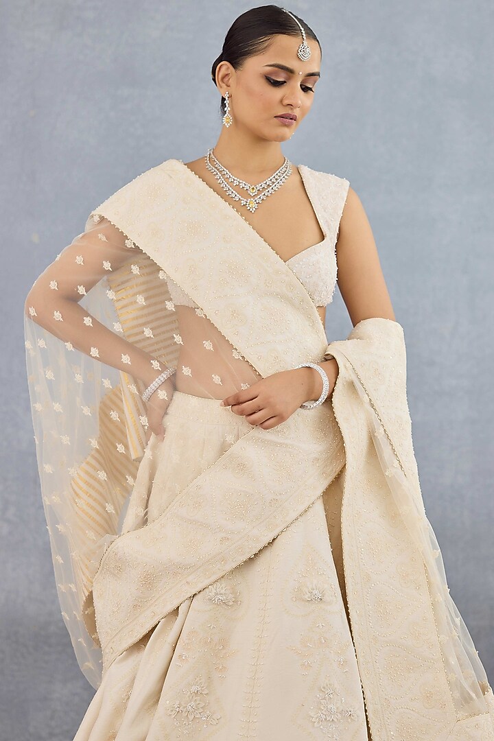 Ivory Jeni Silk & Organza Embroidered Bridal Lehenga Set by TORANI at Pernia's Pop Up Shop