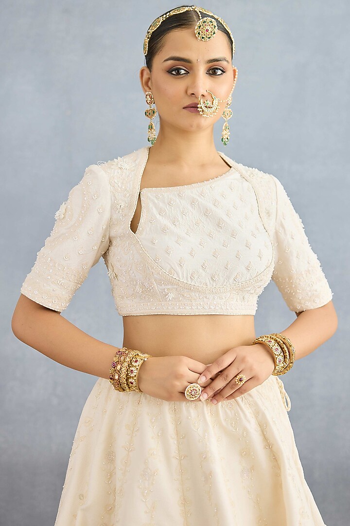 Ivory Jeni Silk & Organza Embroidered Bridal Lehenga Set by TORANI at Pernia's Pop Up Shop