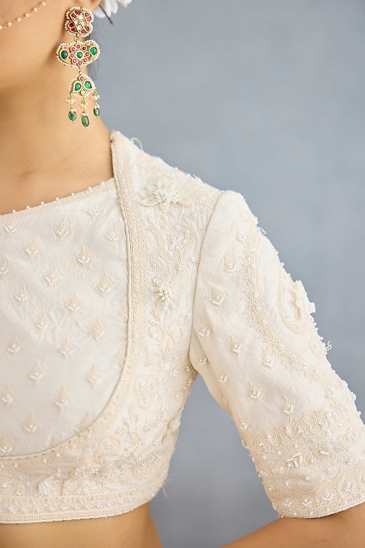 Ivory Jeni Silk & Organza Embroidered Bridal Lehenga Set by TORANI at Pernia's Pop Up Shop