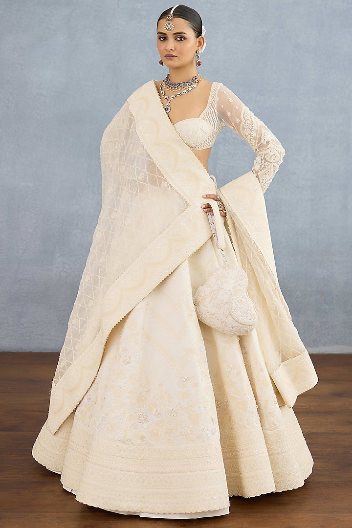 Ivory Jeni Silk & Organza Embroidered Bridal Lehenga Set by TORANI at Pernia's Pop Up Shop