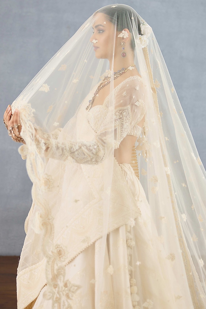 Ivory Jeni Silk & Organza Embroidered Bridal Lehenga Set by TORANI at Pernia's Pop Up Shop