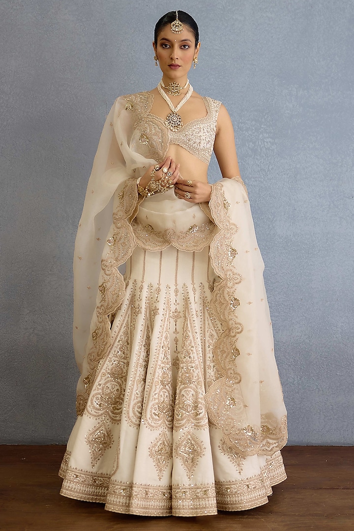 Ivory Jeni Silk & Organza Hand Embroidered Bridal Lehenga Set by TORANI at Pernia's Pop Up Shop