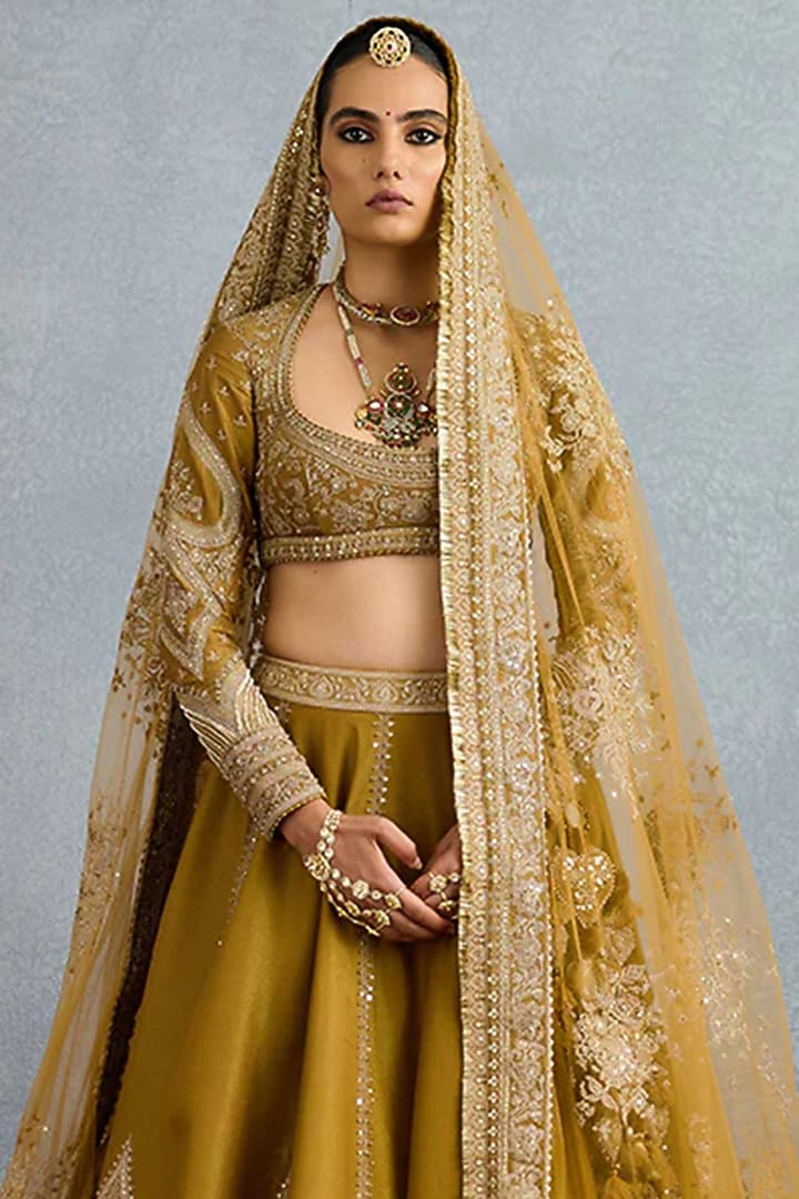Yellow Ochre Tissue Zari Embroidered Bridal Lehenga Set by TORANI at Pernia's Pop Up Shop
