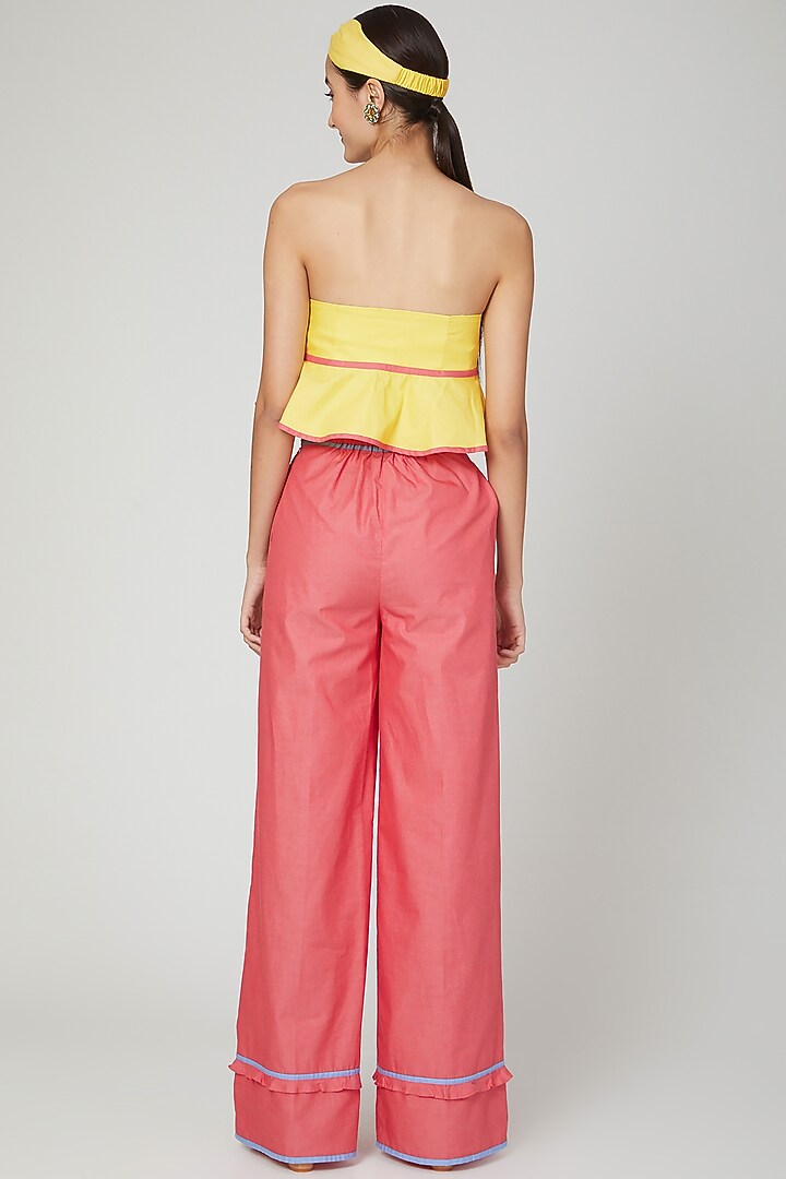 Yellow Flared Peplum Top by Three Piece Company at Pernia's Pop Up Shop