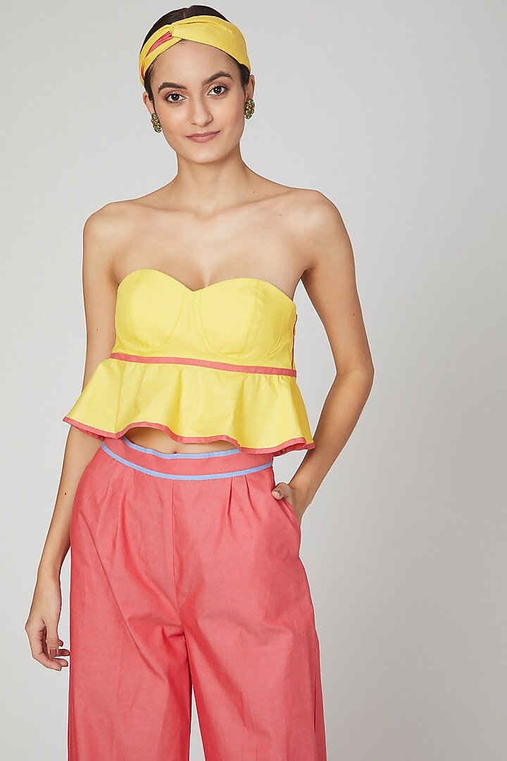 Yellow Flared Peplum Top by Three Piece Company at Pernia's Pop Up Shop