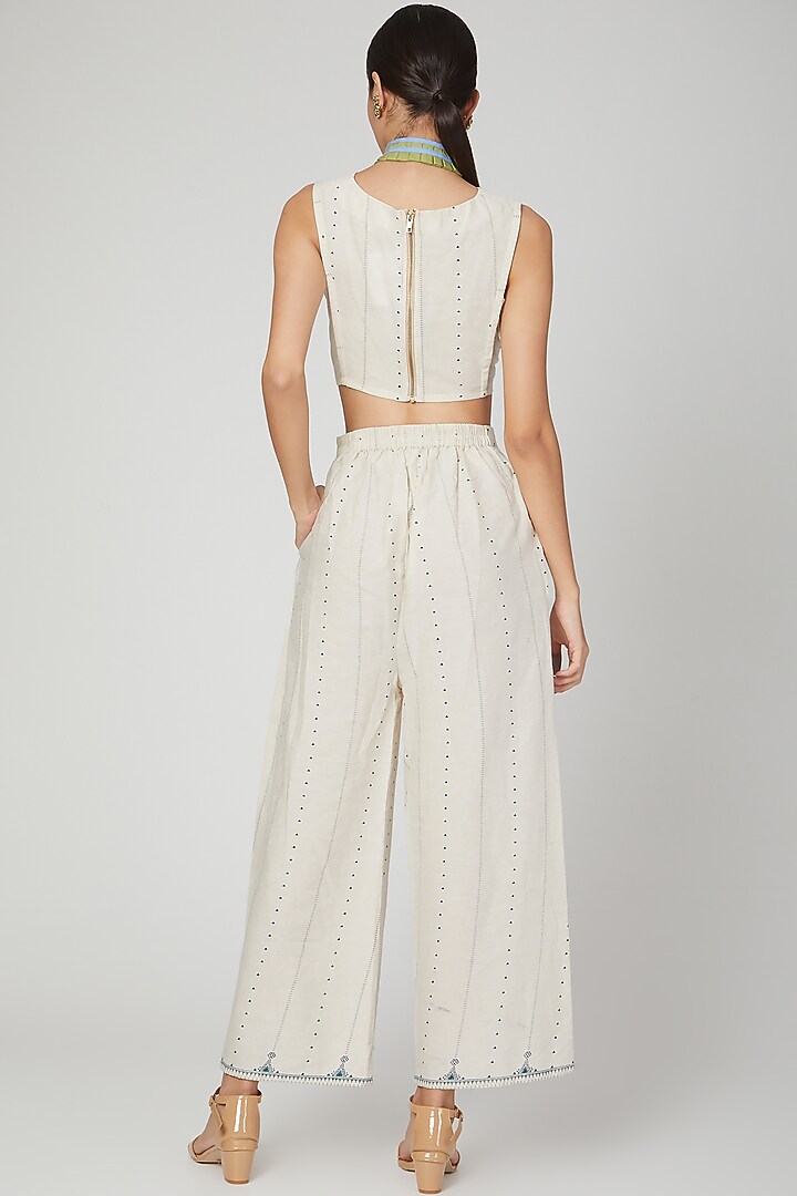 White Block Printed Flared Pants by Three Piece Company at Pernia's Pop Up Shop
