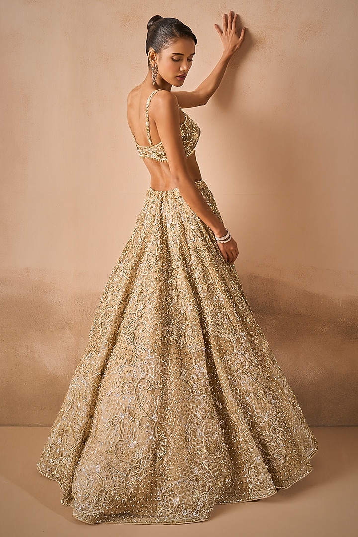 Beige Gold Tulle Sequins Embroidered Bridal Lehenga Set by Tamanna Punjabi Kapoor at Pernia's Pop Up Shop