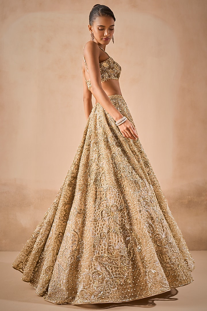 Beige Gold Tulle Sequins Embroidered Bridal Lehenga Set by Tamanna Punjabi Kapoor at Pernia's Pop Up Shop