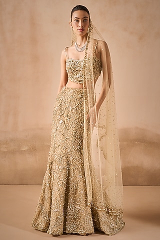 Beige Gold Tulle Sequins Embroidered Flared Lehenga Set by Tamanna Punjabi Kapoor