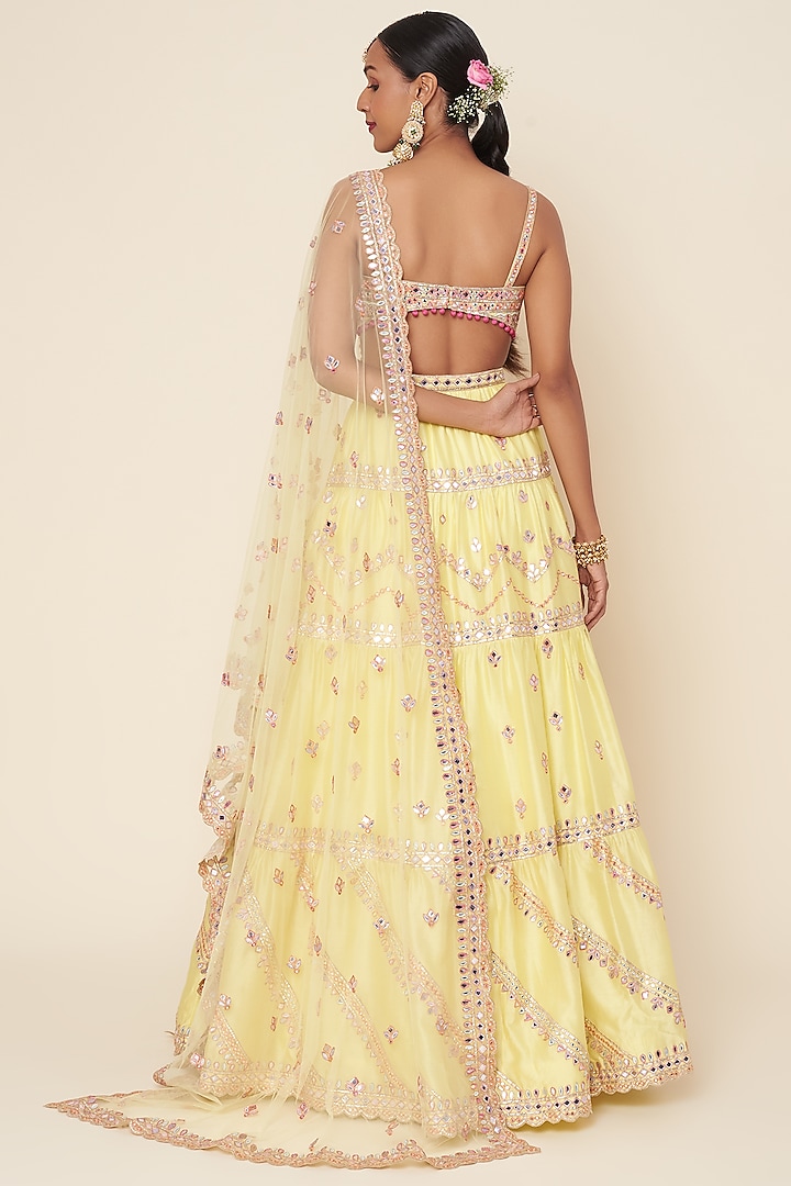 Lemon Yellow Embroidered Tiered Bridal Lehenga Set by Tamanna Punjabi Kapoor at Pernia's Pop Up Shop