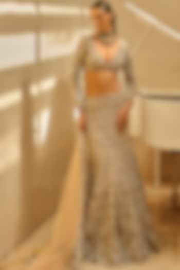 Nude Peach Tulle 3D Floral & Applique Embroidered Bridal Lehenga Set by Tamanna Punjabi Kapoor at Pernia's Pop Up Shop