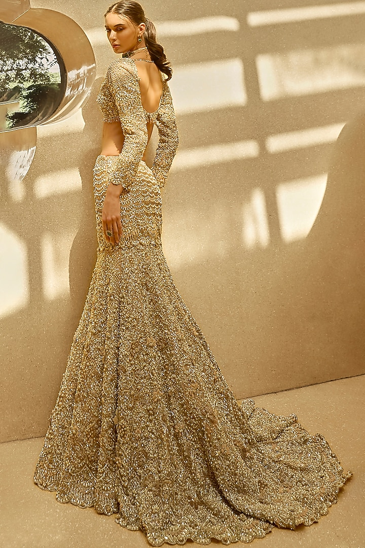 Nude Peach Tulle 3D Floral & Applique Embroidered Bridal Lehenga Set by Tamanna Punjabi Kapoor at Pernia's Pop Up Shop