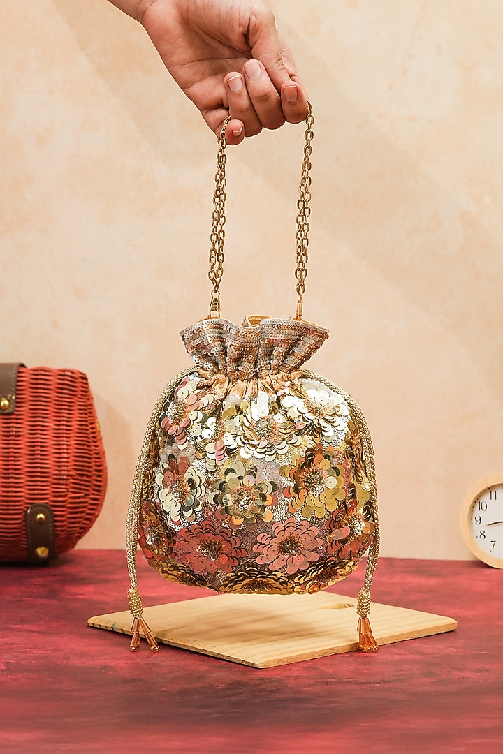 Gold Raw Silk Handcrafted Floral Potli by The Purple Sack at Pernia's Pop Up Shop