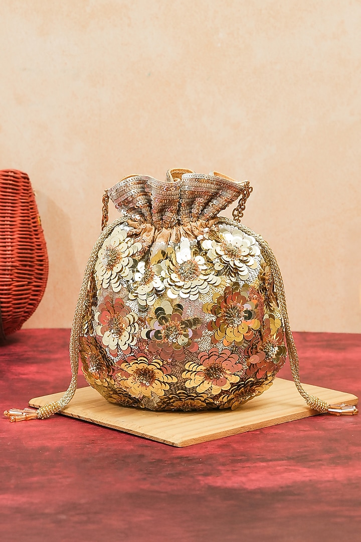 Gold Raw Silk Handcrafted Floral Potli by The Purple Sack at Pernia's Pop Up Shop