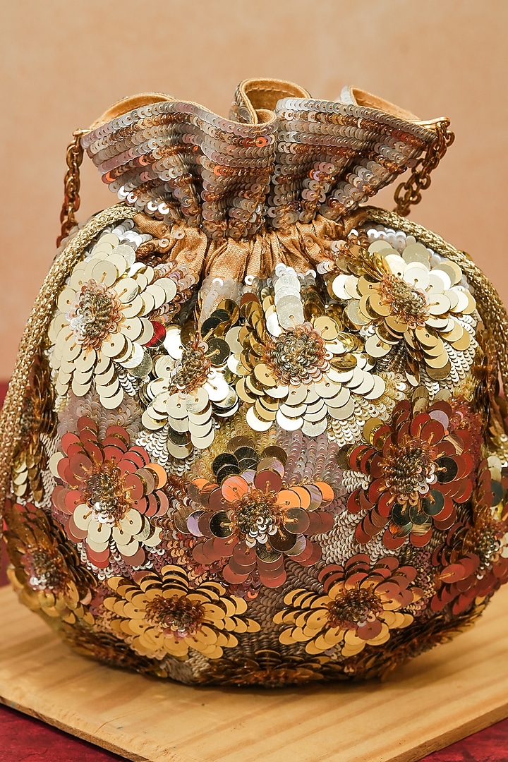 Gold Raw Silk Handcrafted Floral Potli by The Purple Sack at Pernia's Pop Up Shop