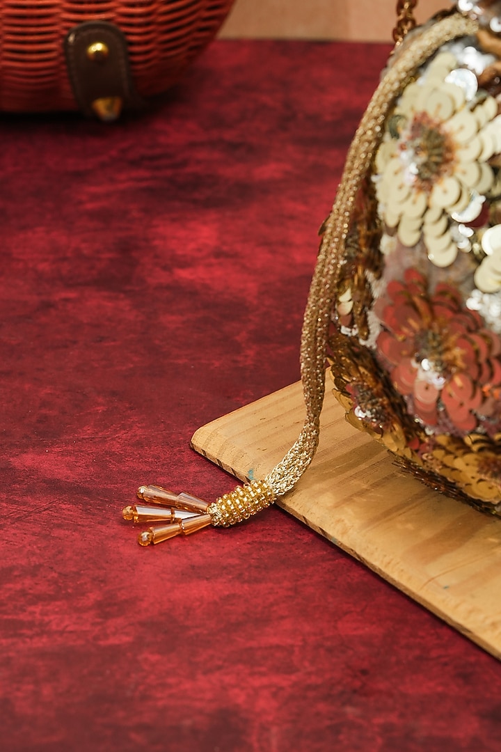 Gold Raw Silk Handcrafted Floral Potli by The Purple Sack at Pernia's Pop Up Shop
