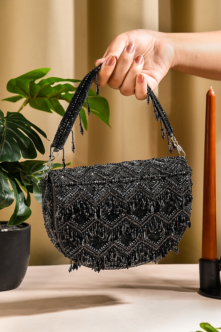 Black Raw Silk Hand Embroidered Latkan Clutch by The Purple Sack at Pernia's Pop Up Shop