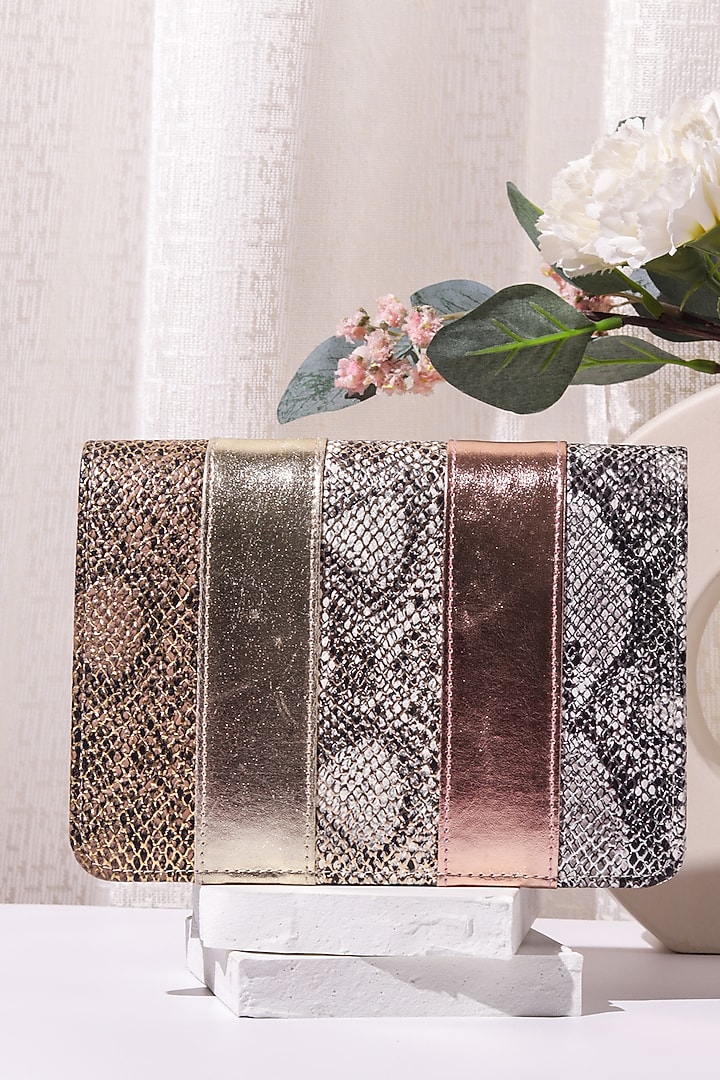 Multi-Colored Leatherette Patchwork Clutch by The Purple Sack at Pernia's Pop Up Shop