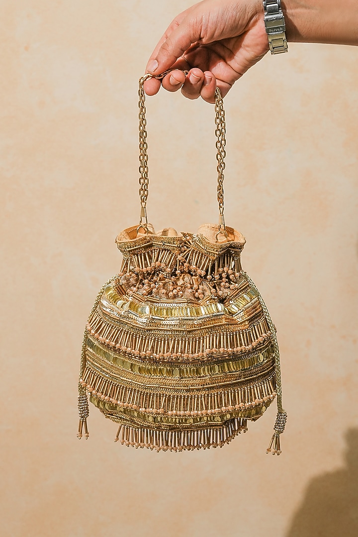 Gold Raw Silk Handcrafted Potli by The Purple Sack at Pernia's Pop Up Shop