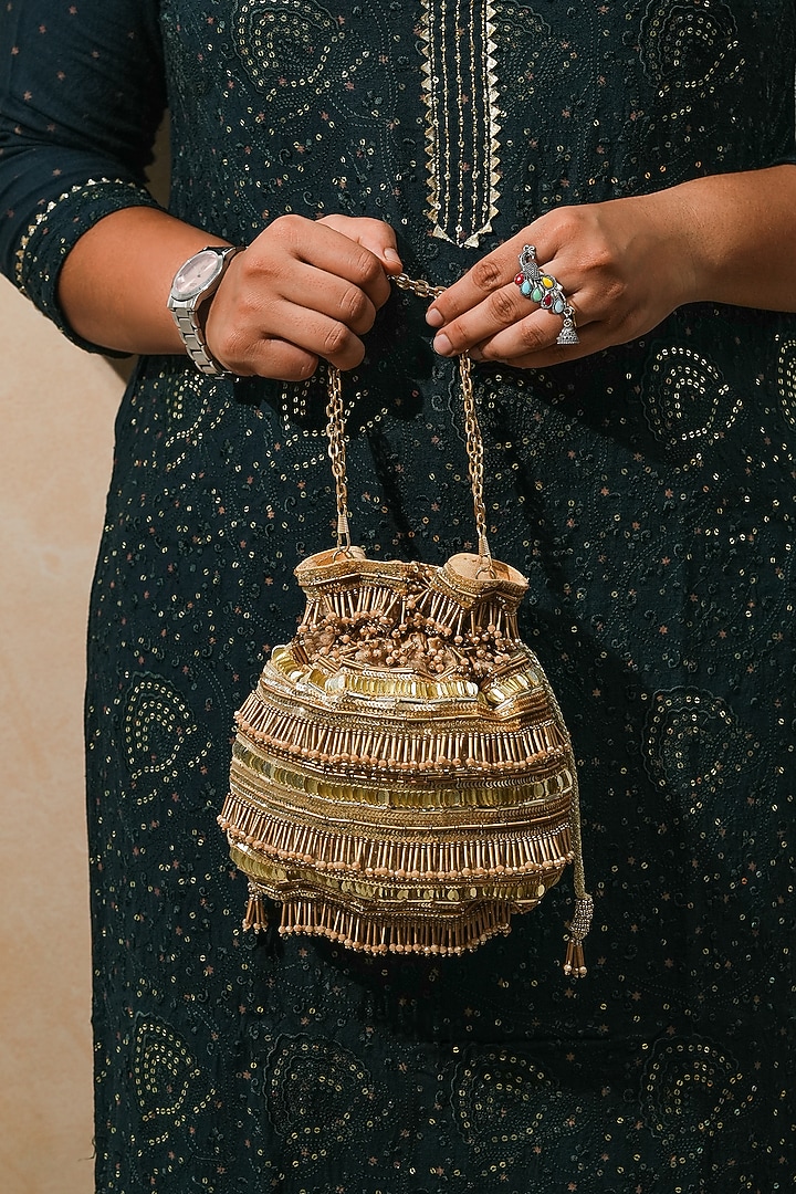 Gold Raw Silk Handcrafted Potli by The Purple Sack at Pernia's Pop Up Shop