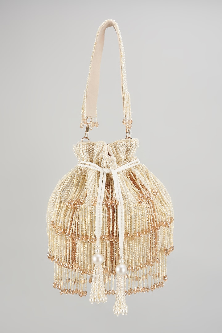 Beige Raw Silk Hand Embroidered Potli by The Purple Sack at Pernia's Pop Up Shop