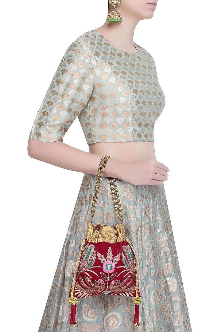 The Pink Potli presents Maroon hand embroidered peacock design velvet potli bag available only at Pernia's Pop Up Shop.