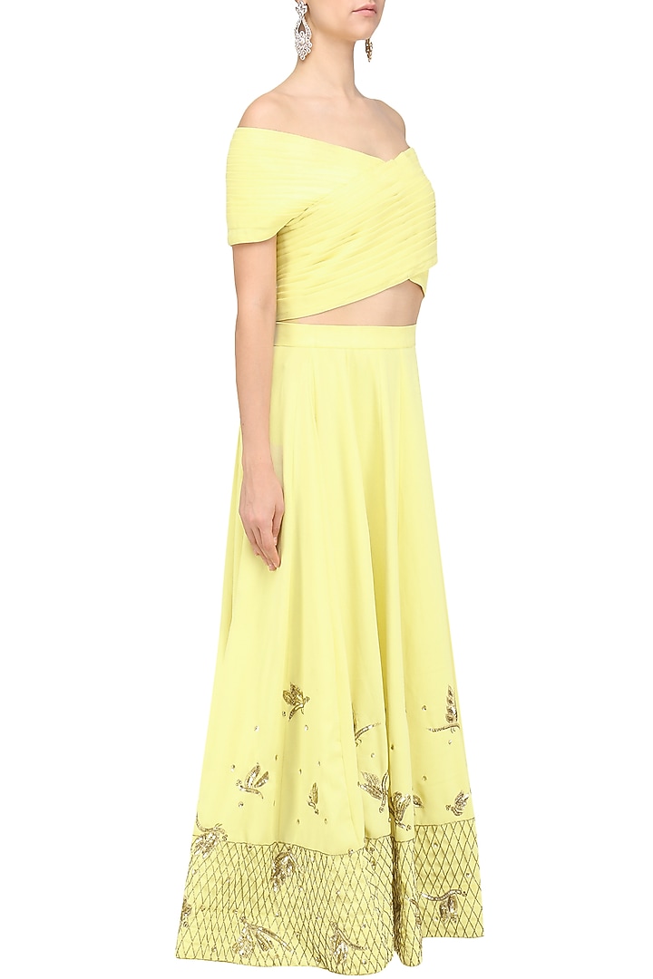 Soft yellow off shoulder crop top and pleated skirt set available only at Pernia's Pop Up Shop.