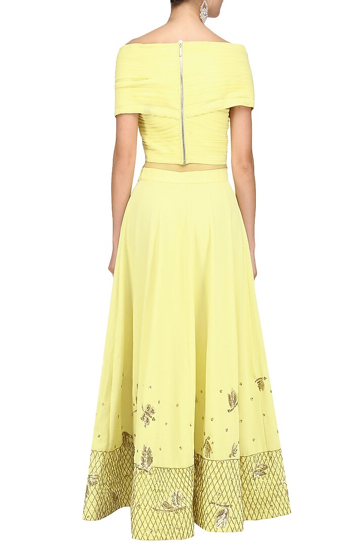 Soft yellow off shoulder crop top and pleated skirt set available only at Pernia's Pop Up Shop.
