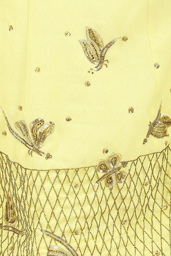 Soft yellow off shoulder crop top and pleated skirt set available only at Pernia's Pop Up Shop.
