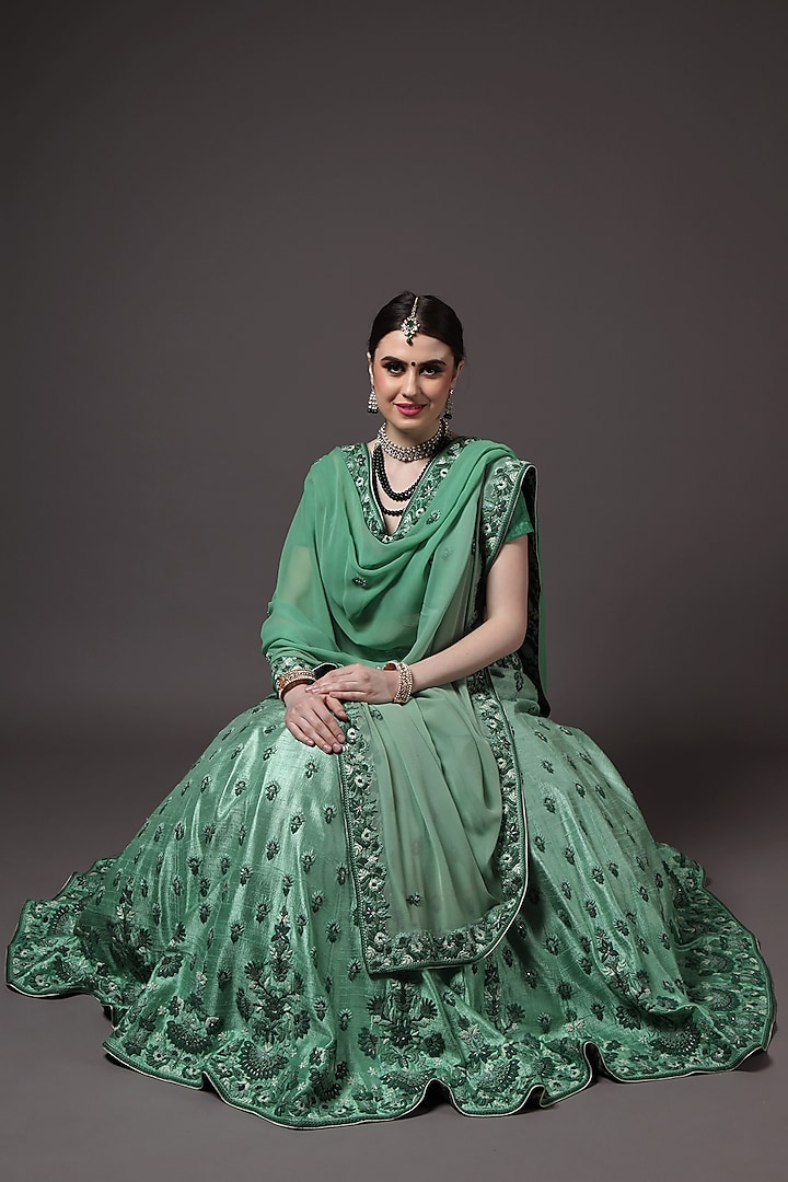 Green Embroidered Lehenga Set by Trisvaraa