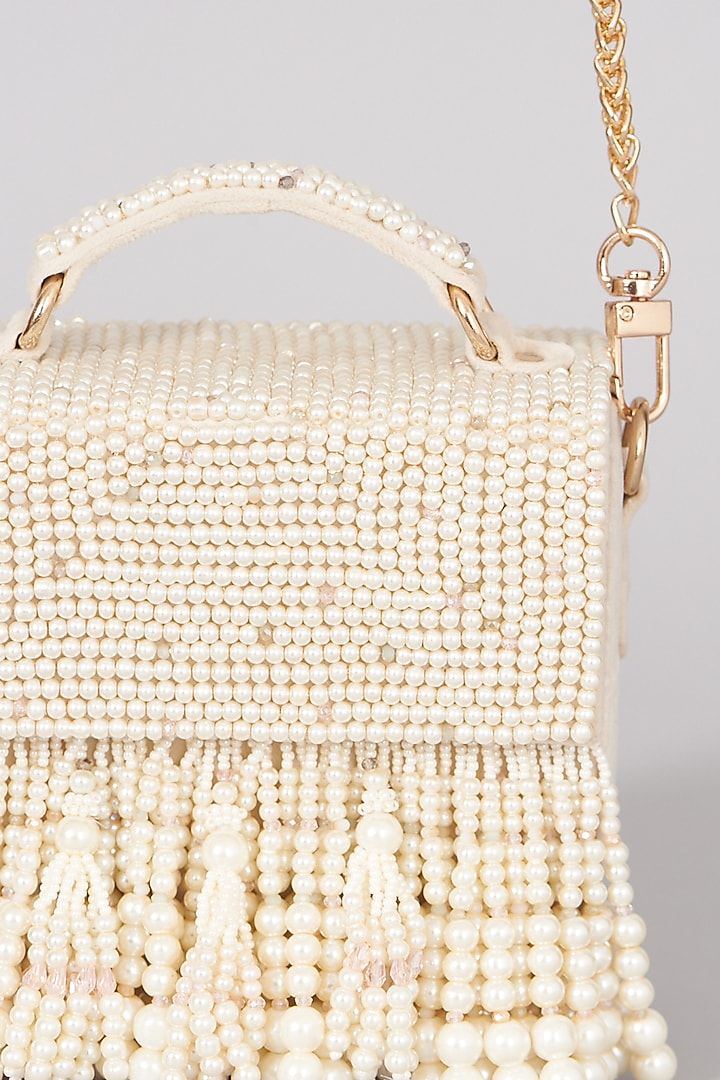 Ivory Hand Embellished Handbag by The Right Sided at Pernia's Pop Up Shop