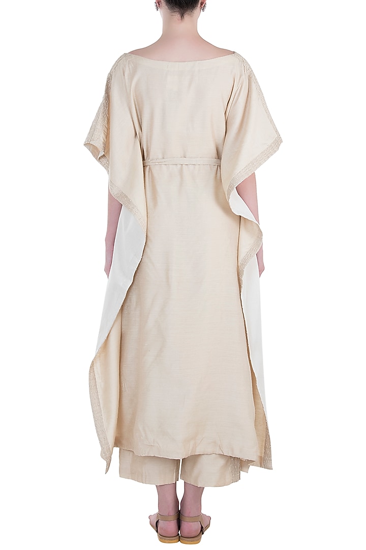 Ivory pintuck embroidered kaftan with trousers and belt available only at Pernia's Pop Up Shop.