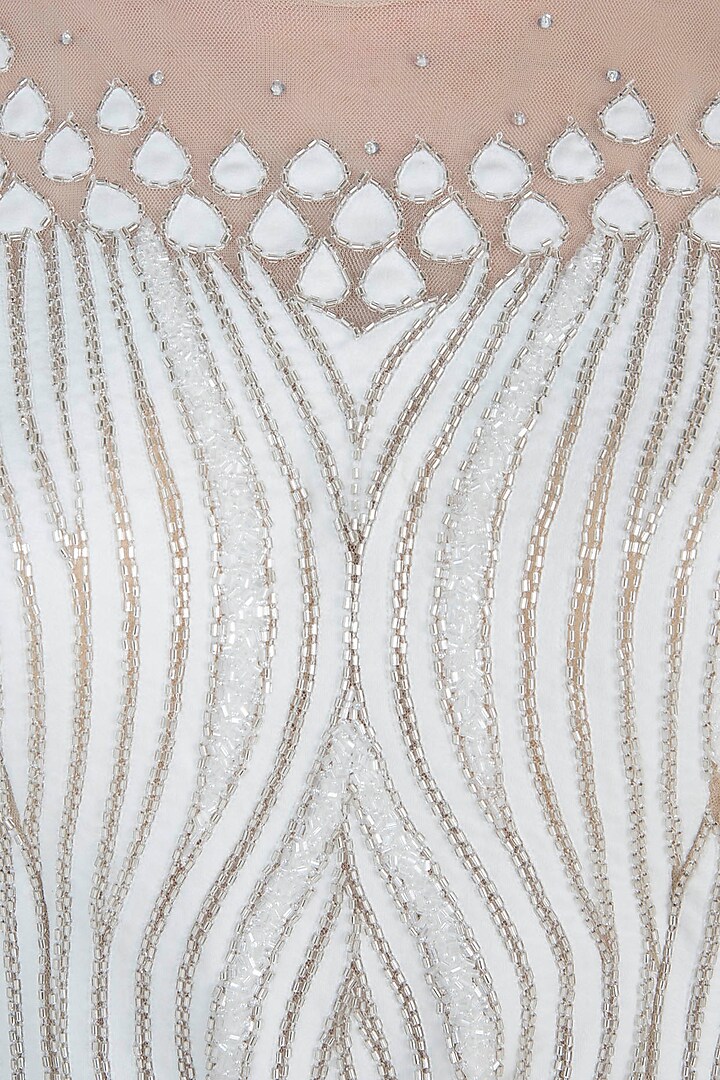 White embroidered jumpsuit available only at Pernia's Pop Up Shop.
