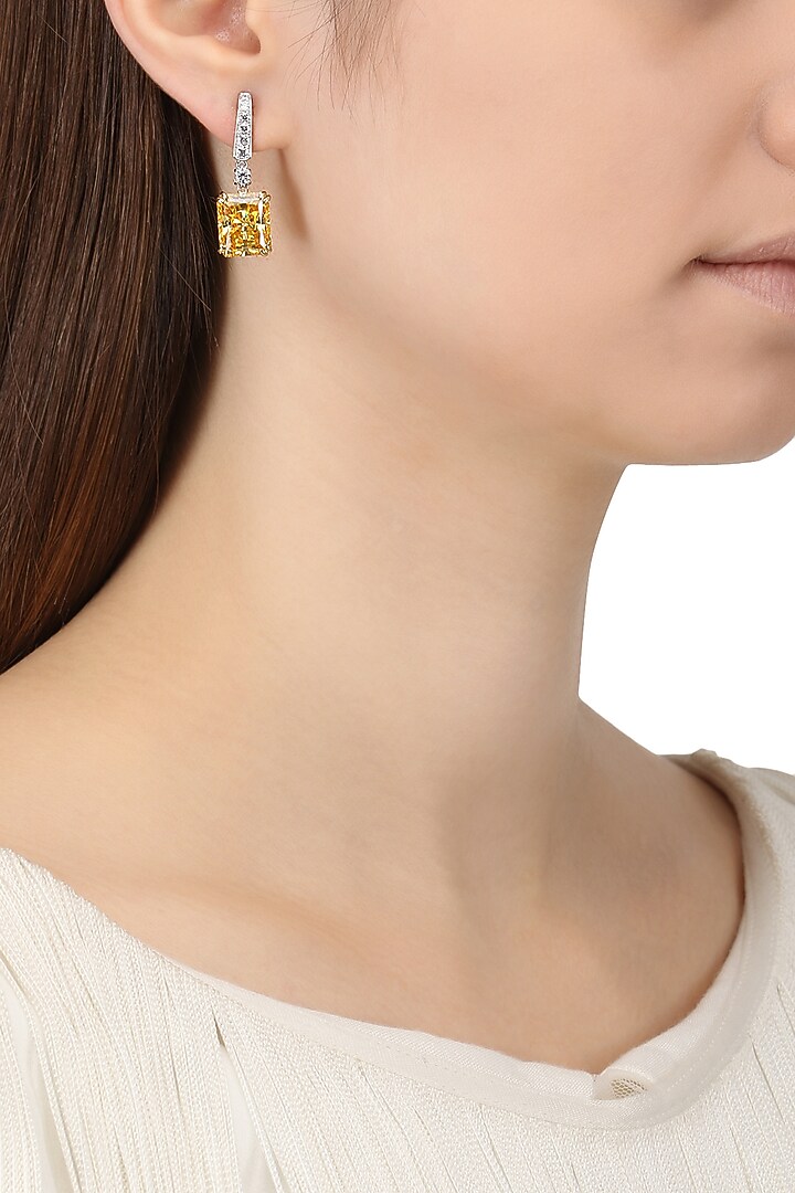 Rhodium finish yellow zircon drop earrings available only at Pernia's Pop Up Shop.