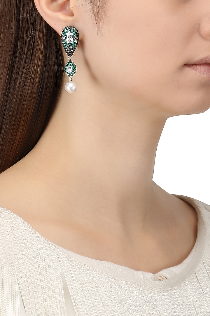Rhodium finish zircons and pearl drop earrings available only at Pernia's Pop Up Shop.