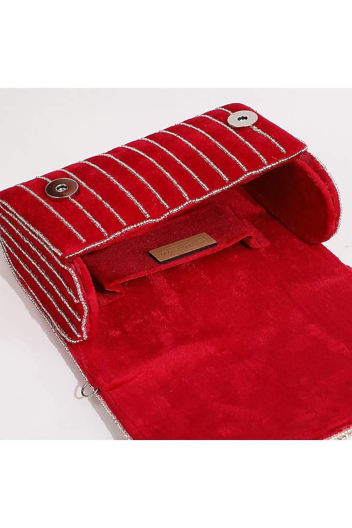 Red Suede Embellished Clutch by THE TAN CLAN at Pernia's Pop Up Shop