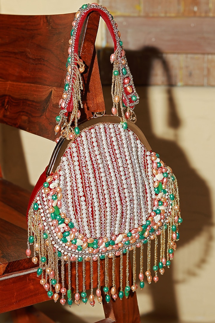Red Suede Handcrafted Half Moon Bag by THE TAN CLAN at Pernia's Pop Up Shop