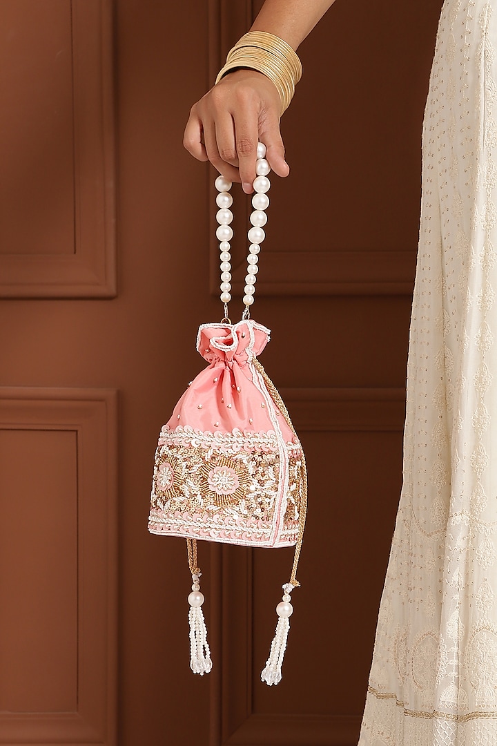 Pink Raw Silk Hand Embroidered Potli by THE TAN CLAN at Pernia's Pop Up Shop