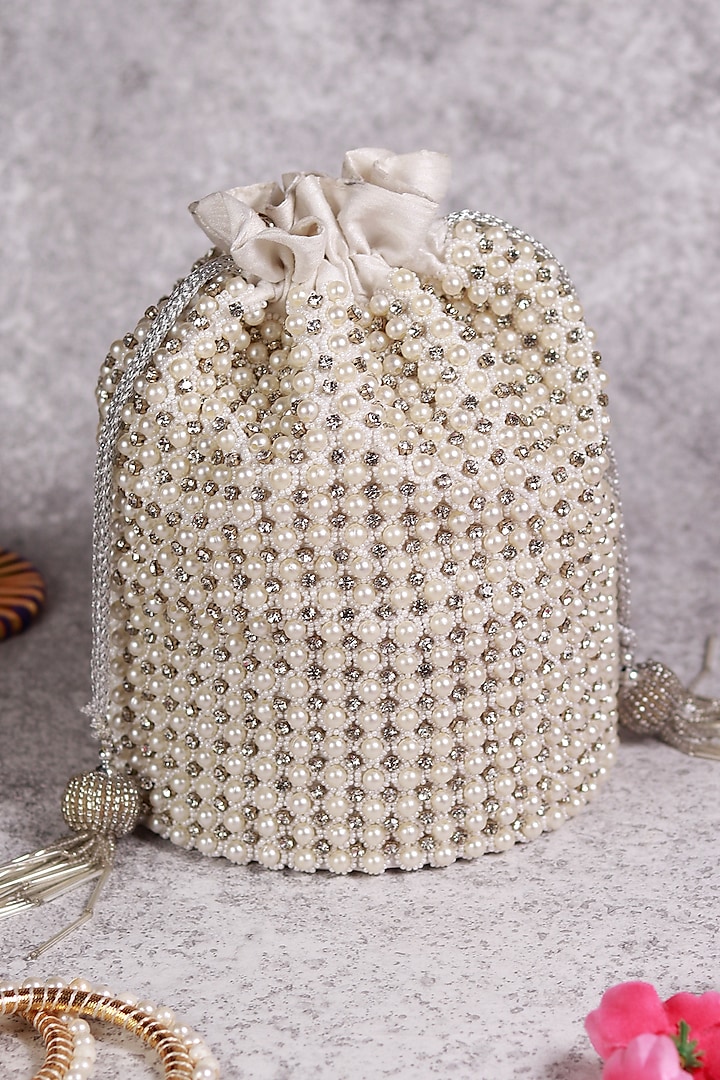 White Raw Silk Hand Embroidered Potli by THE TAN CLAN at Pernia's Pop Up Shop