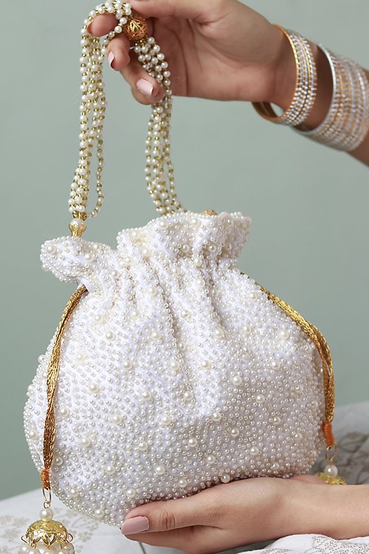 White Raw Silk Pearl Hand Embroidered Potli by THE TAN CLAN at Pernia's Pop Up Shop