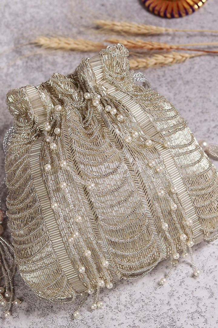 White Raw Silk Hand Embroidered Potli by THE TAN CLAN at Pernia's Pop Up Shop