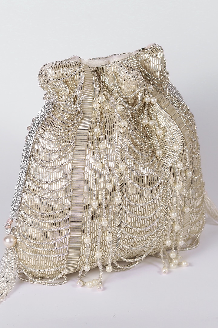 White Raw Silk Hand Embroidered Potli by THE TAN CLAN at Pernia's Pop Up Shop