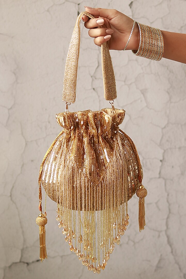 Gold Silk Tassels & Sequins Hand Embroidered Potli by THE TAN CLAN at Pernia's Pop Up Shop