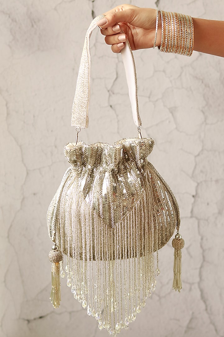 Silver Silk Tassels & Sequins Hand Embroidered Potli by THE TAN CLAN at Pernia's Pop Up Shop