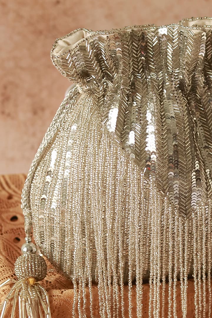 Silver Silk Tassels & Sequins Hand Embroidered Potli by THE TAN CLAN at Pernia's Pop Up Shop