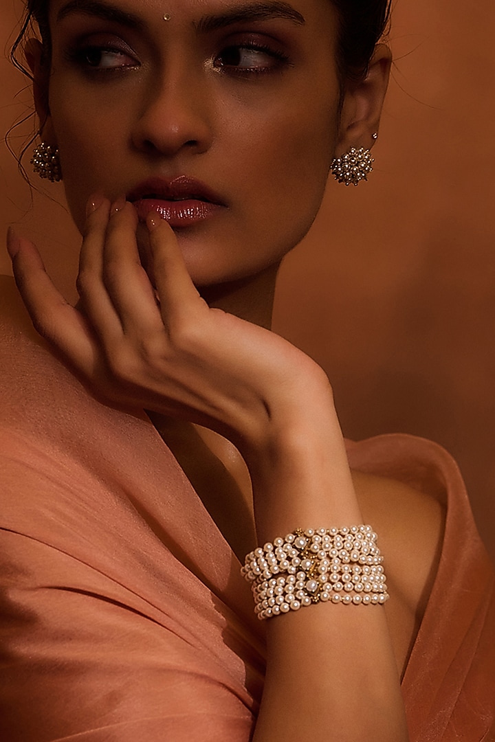 Gold Finish Freshwater & Swarovski Pearl Bracelet In Sterling Silver by Tarun Tahiliani Accessories