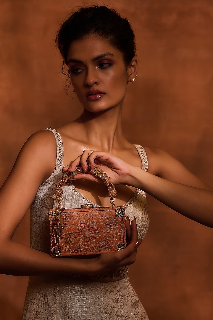 Orange Brocade & Viscose Satin Beaded Tassel Embellished clutch by Tarun Tahiliani Accessories at Pernia's Pop Up Shop
