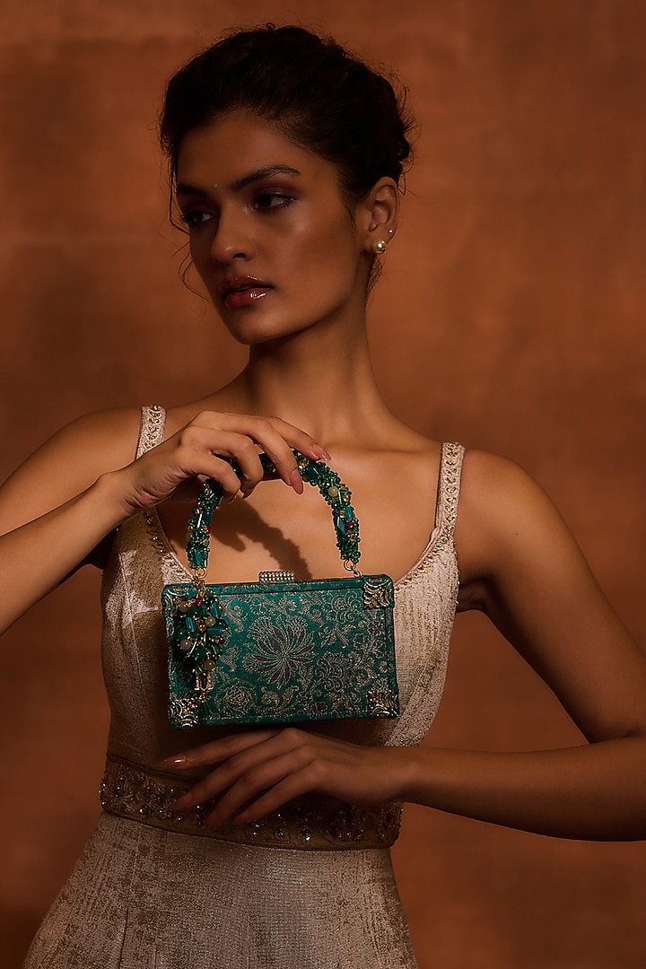 Teal Brocade & Viscose Satin Beaded Tassel Embellished clutch by Tarun Tahiliani Accessories at Pernia's Pop Up Shop