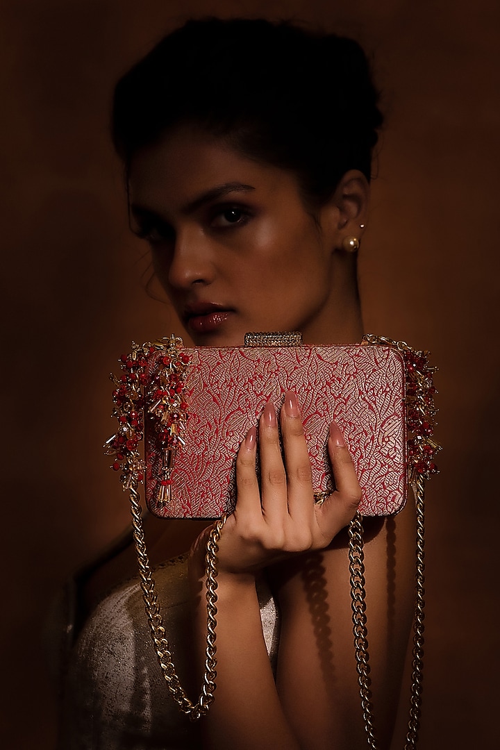 Red Brocade & Viscose Satin Beaded Tassel Embellished clutch by Tarun Tahiliani Accessories at Pernia's Pop Up Shop