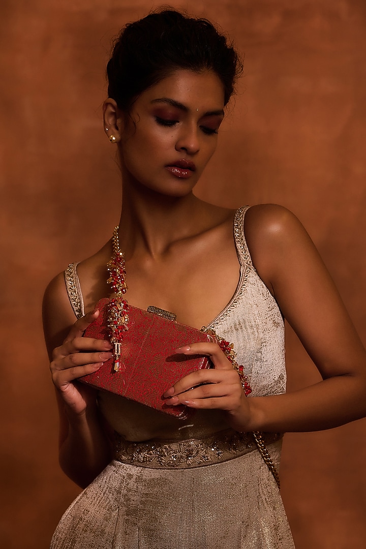 Red Brocade & Viscose Satin Beaded Tassel Embellished clutch by Tarun Tahiliani Accessories at Pernia's Pop Up Shop